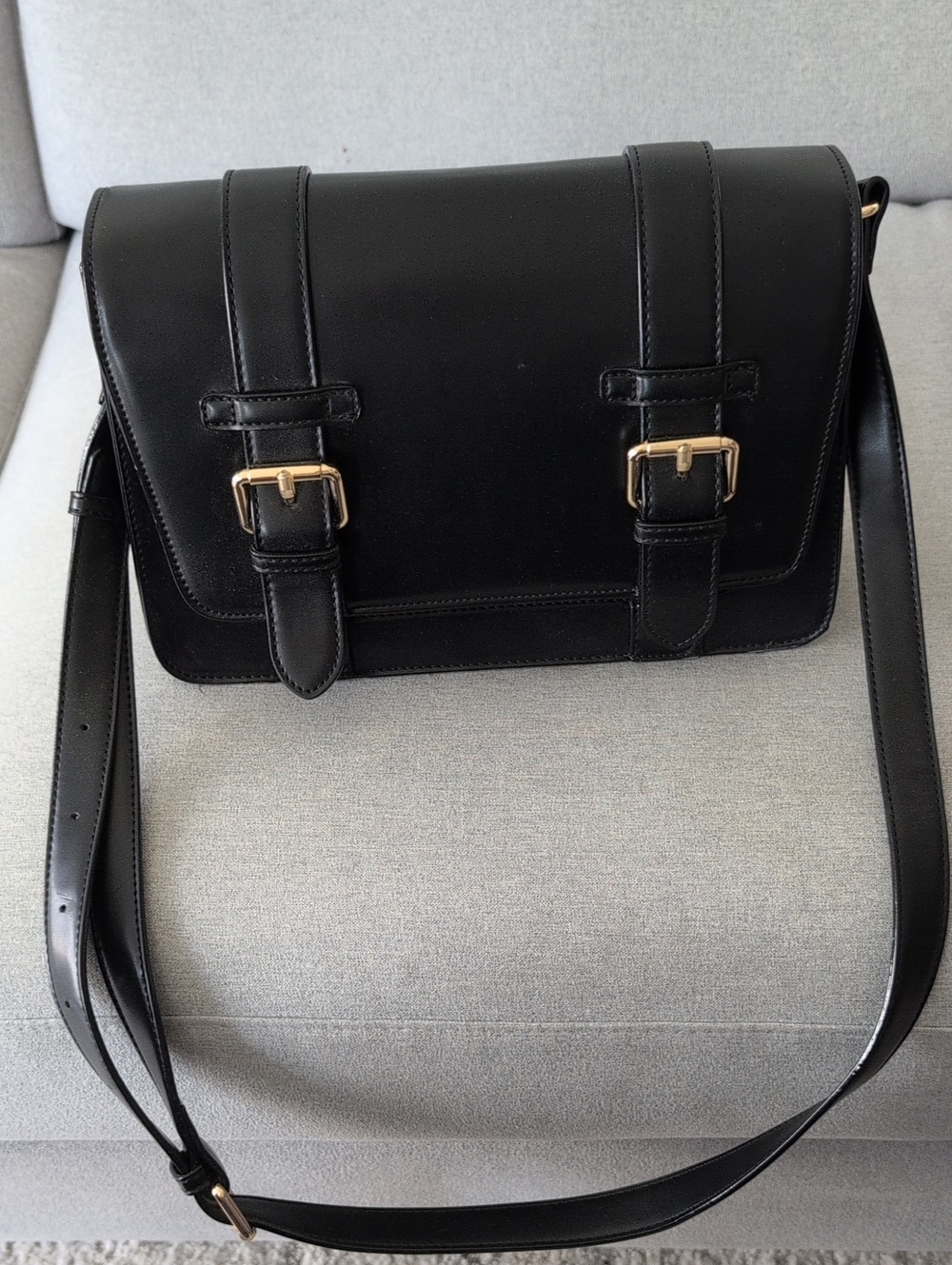Classic Black Leather Crossbody with Gold Buckle Detail
